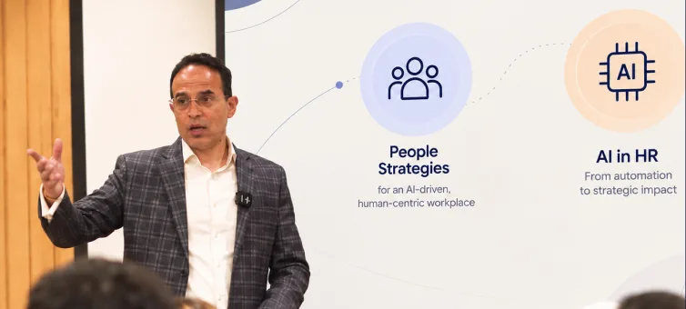Faculty member presenting people strategies and AI in HR