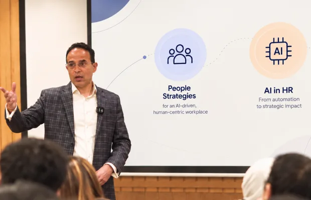 Faculty member presenting people strategies and AI in HR
